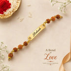 Personalized Name Rudraksha Rakhi – Custom Engraved Gold Finish Metal Bracelet